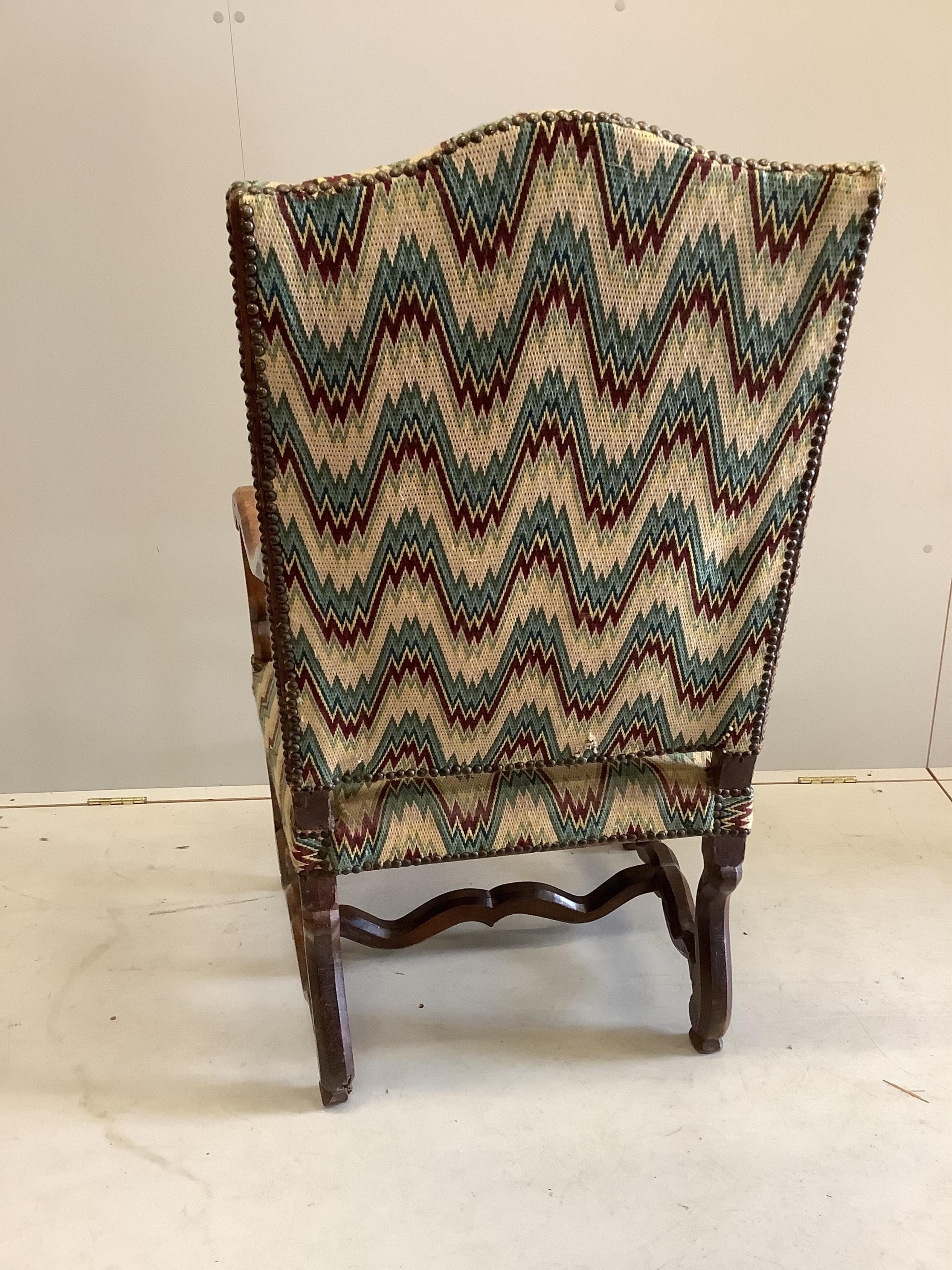 A 19th century French walnut armchair, in the 17th century style, width 64cm, height 116cm. Condition - heavily wormed, frame wobbling